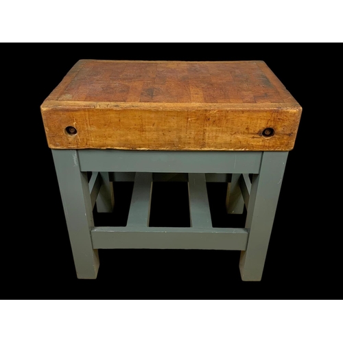 873 - A large butcher block on stand. 91.5 x 62 x 90.5cm