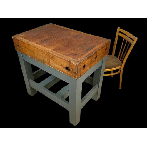 873 - A large butcher block on stand. 91.5 x 62 x 90.5cm