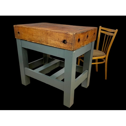 873 - A large butcher block on stand. 91.5 x 62 x 90.5cm