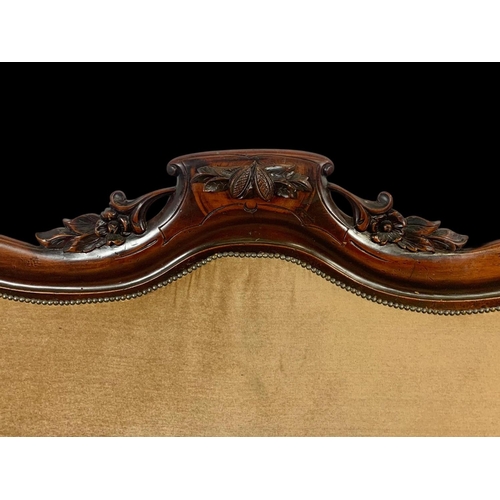 875 - A Victorian carved mahogany double end couch. Circa 1870. 207cm