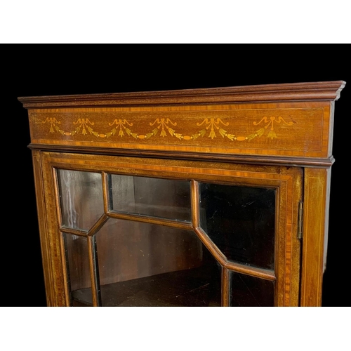 876 - An Edwardian inlaid corner display cabinet. 61 x 38.5 x 150cm