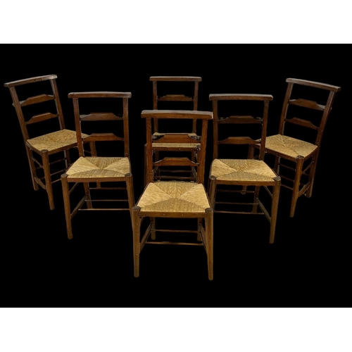 879 - A set of 6 early 20th century church chairs with rush seats. Circa 1920.