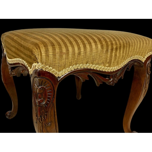 881 - A Victorian carved mahogany footstool. Circa 1870. 47 x 46 x 44cm.