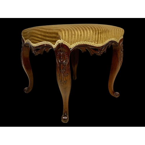 881 - A Victorian carved mahogany footstool. Circa 1870. 47 x 46 x 44cm.