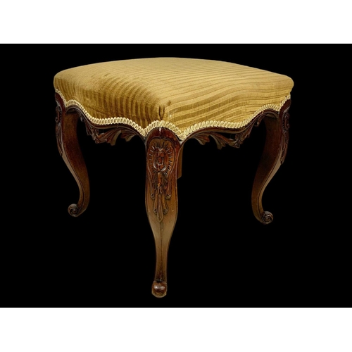 881 - A Victorian carved mahogany footstool. Circa 1870. 47 x 46 x 44cm.