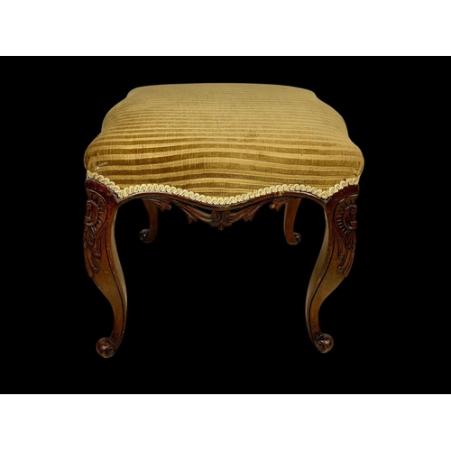 881 - A Victorian carved mahogany footstool. Circa 1870. 47 x 46 x 44cm.