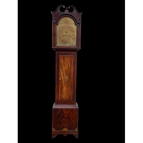 882 - A late Georgian inlaid mahogany long case clock, with brass face. Circa 1820. With weights and pendu... 