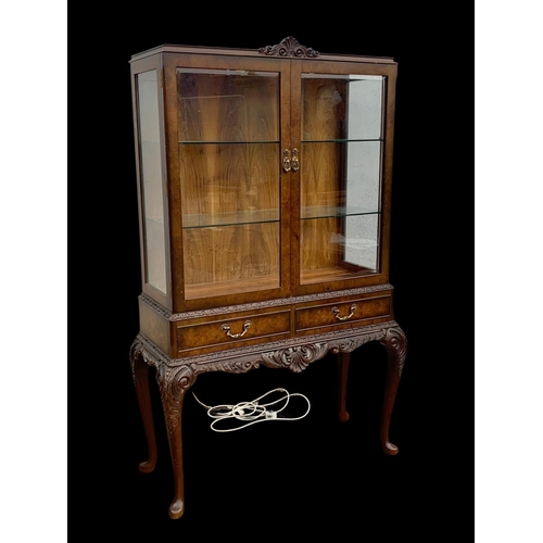 883 - A vintage carved walnut display cabinet. In the Georgian style. Circa 1950.  99 x 42 x 159.5cm