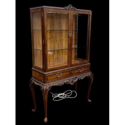 883 - A vintage carved walnut display cabinet. In the Georgian style. Circa 1950.  99 x 42 x 159.5cm