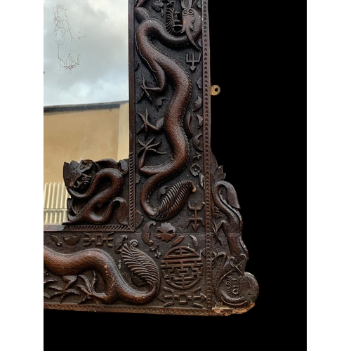 884 - A large 19th century Chinese carved framed mirror. Circa 1880. 137 x 103cm.