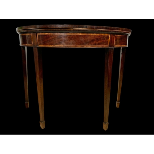 891 - A Georgian Sheraton inlaid mahogany turnover games table with satinwood cross banding. 96.5 x 48 x 7... 