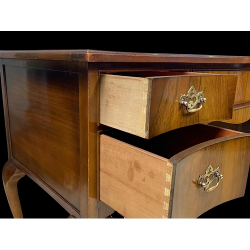 906 - A vintage walnut leather top writing desk. Circa 1950. 124 x 60 x 76.5cm