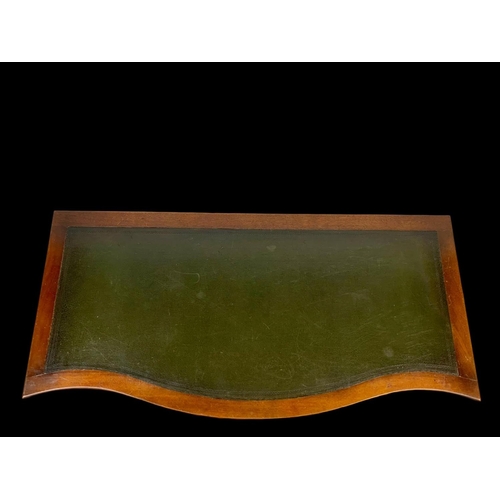 906 - A vintage walnut leather top writing desk. Circa 1950. 124 x 60 x 76.5cm