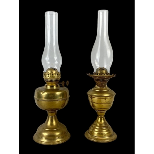 91 - 2 early 20th century brass oil lamps. 50cm.
