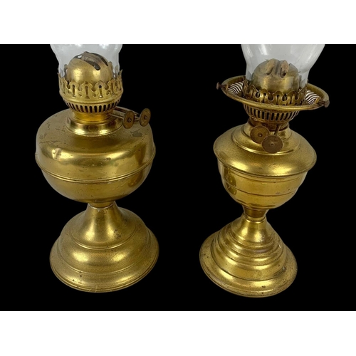 91 - 2 early 20th century brass oil lamps. 50cm.