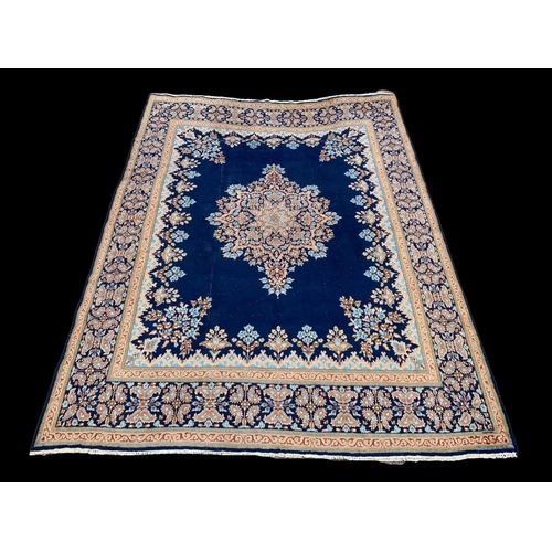 912 - A large vintage Middle Eastern hand knotted rug. Iran. 291.5 x 399cm