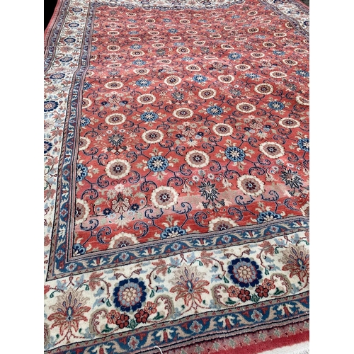 914 - A large Middle Eastern style hand knotted rug. 206 x 304cm.