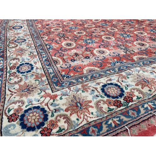 914 - A large Middle Eastern style hand knotted rug. 206 x 304cm.