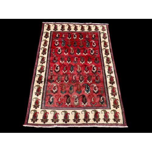 924 - A large vintage Middle Eastern hand knotted rug. 104 x 217cm