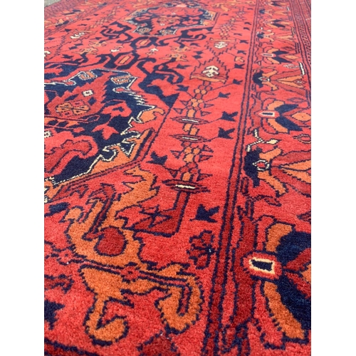 926 - A large vintage Middle Eastern runner/rug. 83 x 313cm