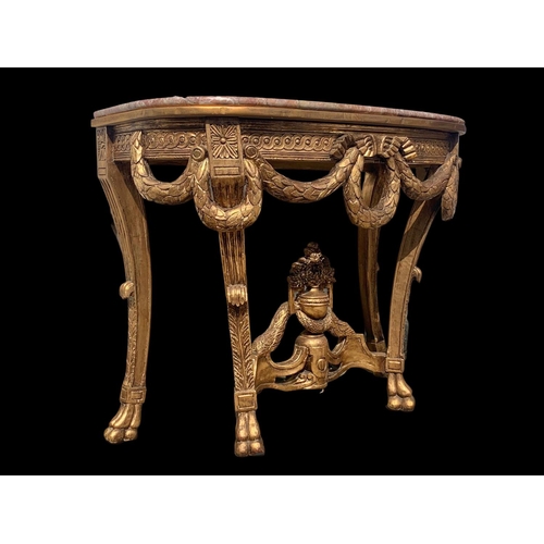 931 - A Regency style gilt marble top console table. 103 x 48 x 81cm.