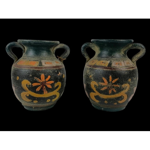 94 - A pair of vintage Middle Eastern ceramic pots with handles. 16 x 17cm.