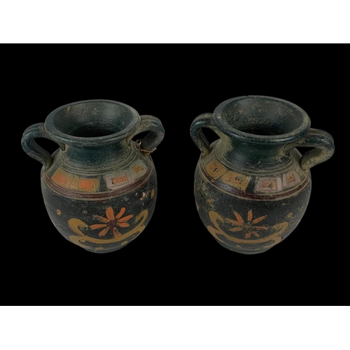 94 - A pair of vintage Middle Eastern ceramic pots with handles. 16 x 17cm.