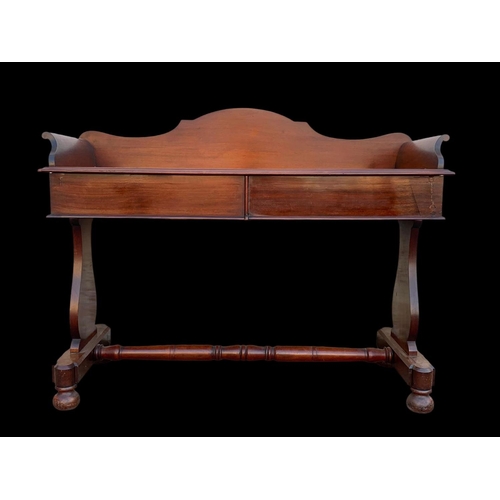 940 - A Victorian mahogany 2 drawer washstand/ gallery back side table. 122 x 51 x 99.5cm.