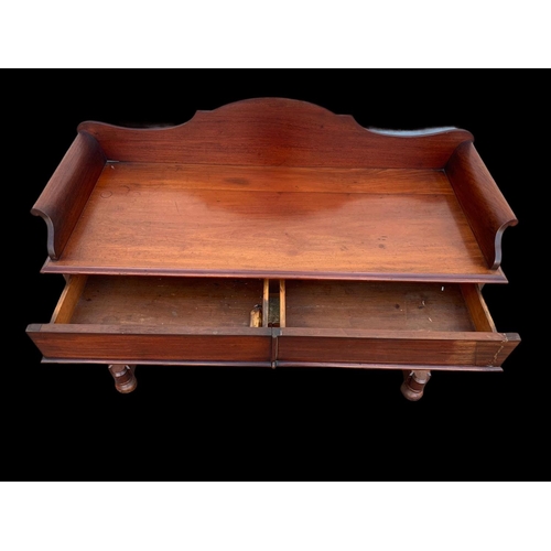 940 - A Victorian mahogany 2 drawer washstand/ gallery back side table. 122 x 51 x 99.5cm.