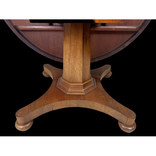 944 - A large William IV rosewood tilt top breakfast table. 136 x 73.5cm.