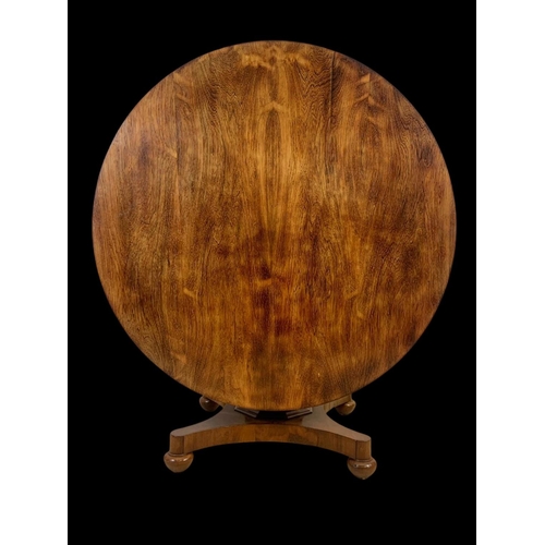 944 - A large William IV rosewood tilt top breakfast table. 136 x 73.5cm.