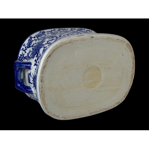 96 - A large blue and white earthenware foot bath/planter. 46 x 32 x 21cm