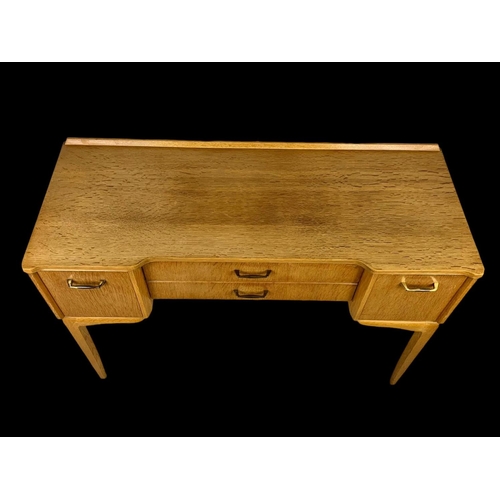 972 - A vintage writing desk by Lebus Furniture. 108x44x77.5cm