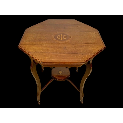 976 - An Edwardian inlaid window table. 72 x 72 x 71cm.