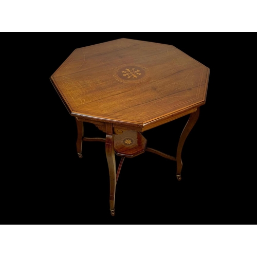 976 - An Edwardian inlaid window table. 72 x 72 x 71cm.