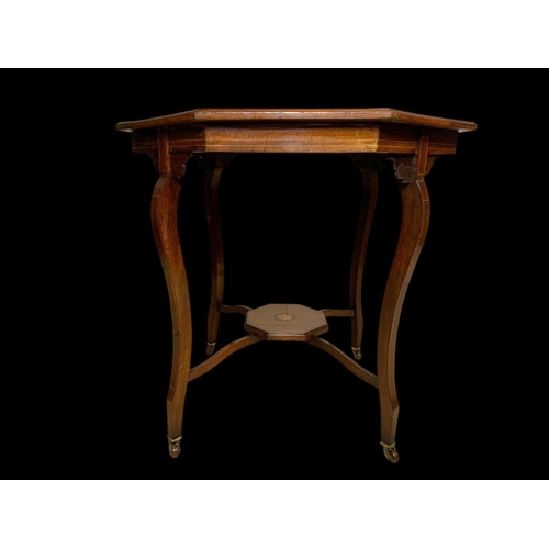 976 - An Edwardian inlaid window table. 72 x 72 x 71cm.