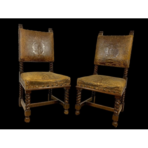 977 - A pair of late 19th century oak rectory chairs in the Jacobean style with original leather and eccle... 