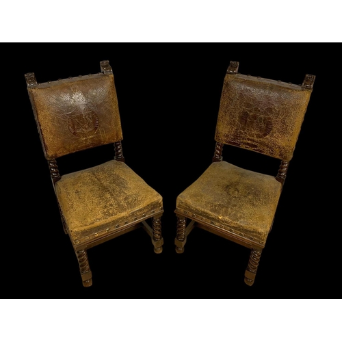 977 - A pair of late 19th century oak rectory chairs in the Jacobean style with original leather and eccle... 