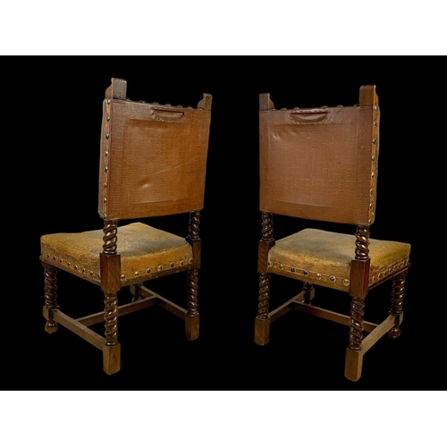 977 - A pair of late 19th century oak rectory chairs in the Jacobean style with original leather and eccle... 