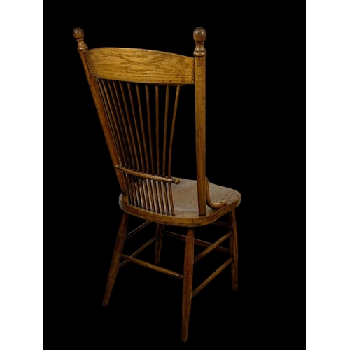 986 - A late 19th century American oak stick back kitchen chair. Circa 1880-1890.