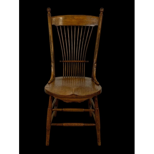 986 - A late 19th century American oak stick back kitchen chair. Circa 1880-1890.