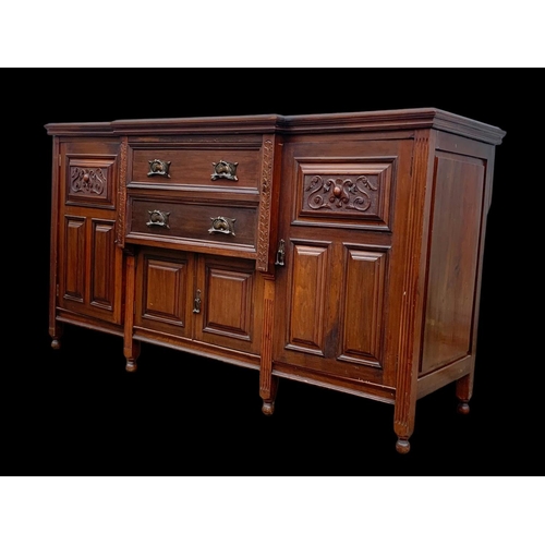 987 - A large Edwardian walnut sideboard with Art Nouveau drop handles. 183 x 62 x 102cm. Including a larg... 