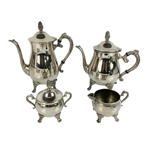 574 - 4 piece early 20th century silver plated tea service. With 2 silver plated food warmers. Food warmer... 