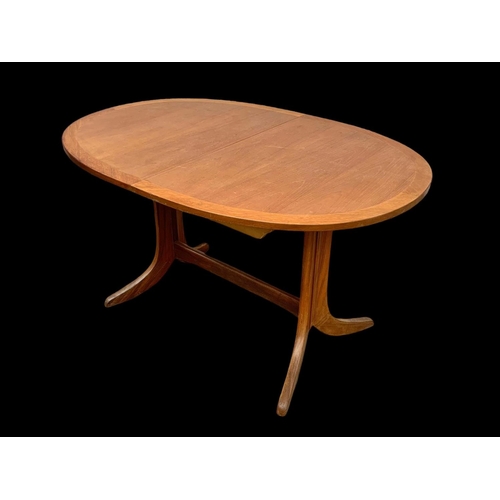 1014 - A Nathan Furniture teak extending dining table. Mid century. Circa 1970. Extended 174.5 x 91 x 74cm.