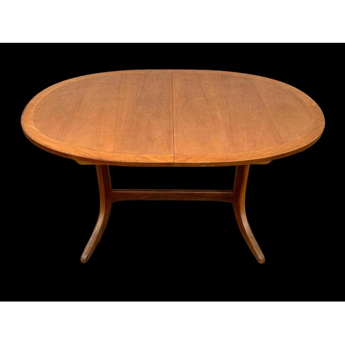 1014 - A Nathan Furniture teak extending dining table. Mid century. Circa 1970. Extended 174.5 x 91 x 74cm.