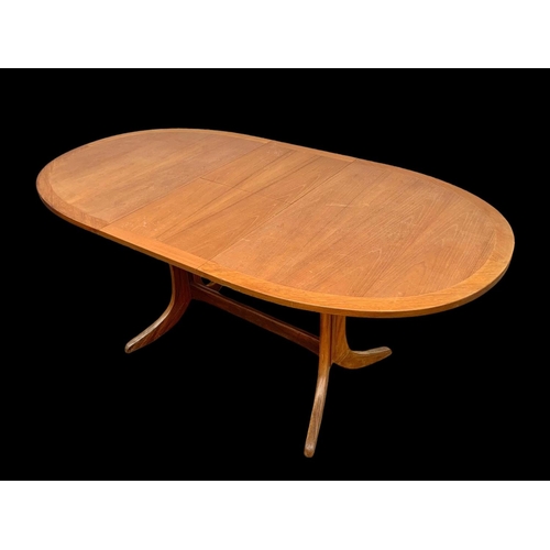 1014 - A Nathan Furniture teak extending dining table. Mid century. Circa 1970. Extended 174.5 x 91 x 74cm.