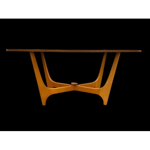 1025 - A teak and bench Astro coffee table with smoked glass top. Mid century. Circa 1960-1970. 107 x 53.5 ... 