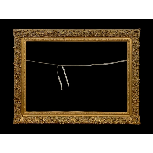 196 - A large Victorian ornate gilt frame with glass. 104 x 8.5 x 79cm