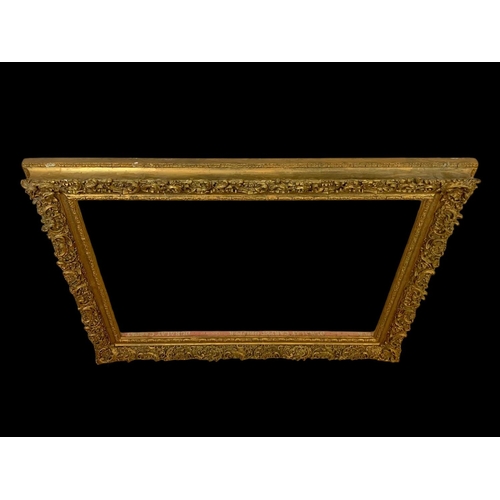 196 - A large Victorian ornate gilt frame with glass. 104 x 8.5 x 79cm