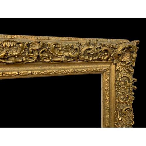 196 - A large Victorian ornate gilt frame with glass. 104 x 8.5 x 79cm